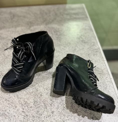 Companheira usa salto de sapato para defender marido